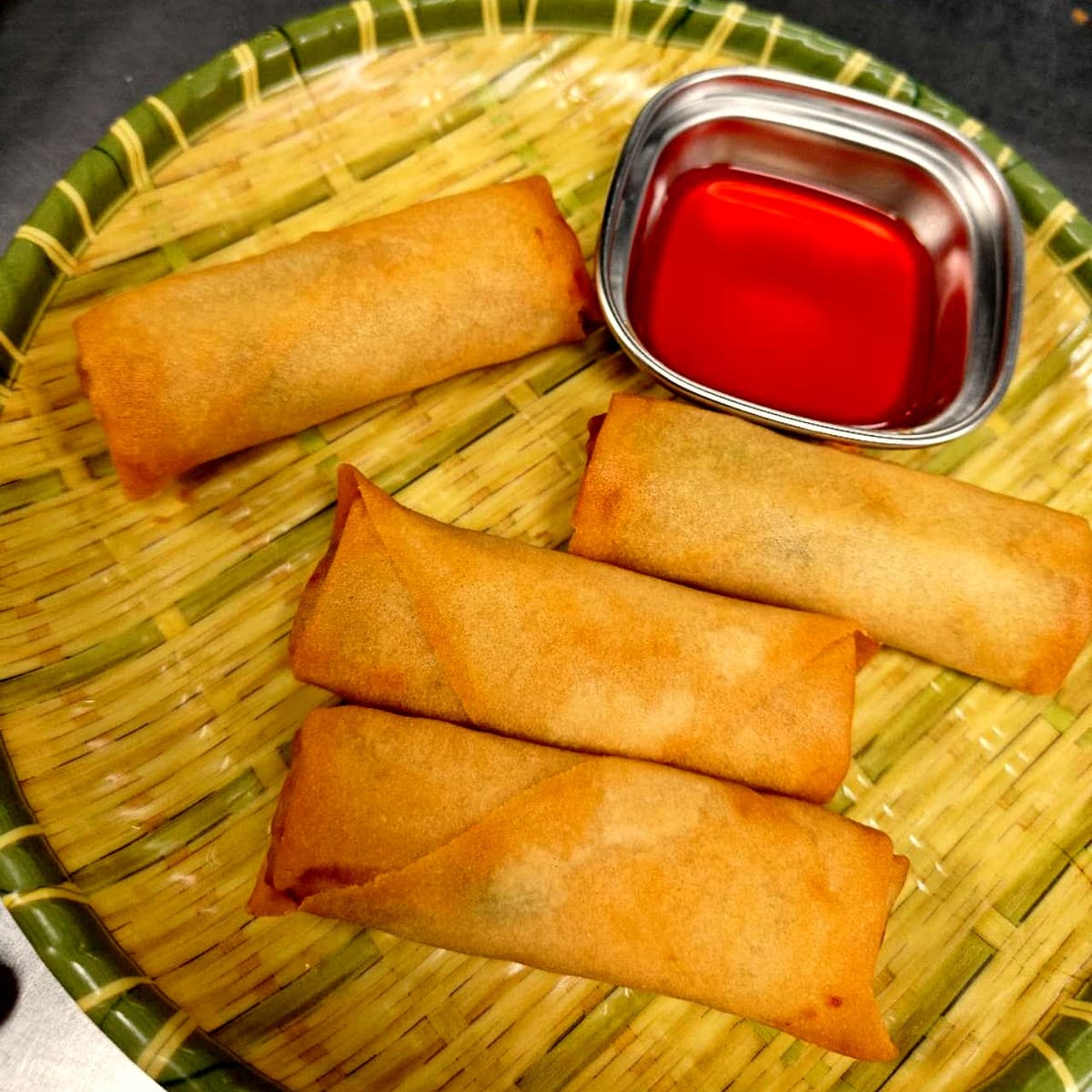 Crispy spring rolls with sweet chili sauce at Ombu Grill